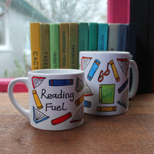 Load image into Gallery viewer, Reading fuel mug colourful books mug by Laura Lee Designs Cornwall