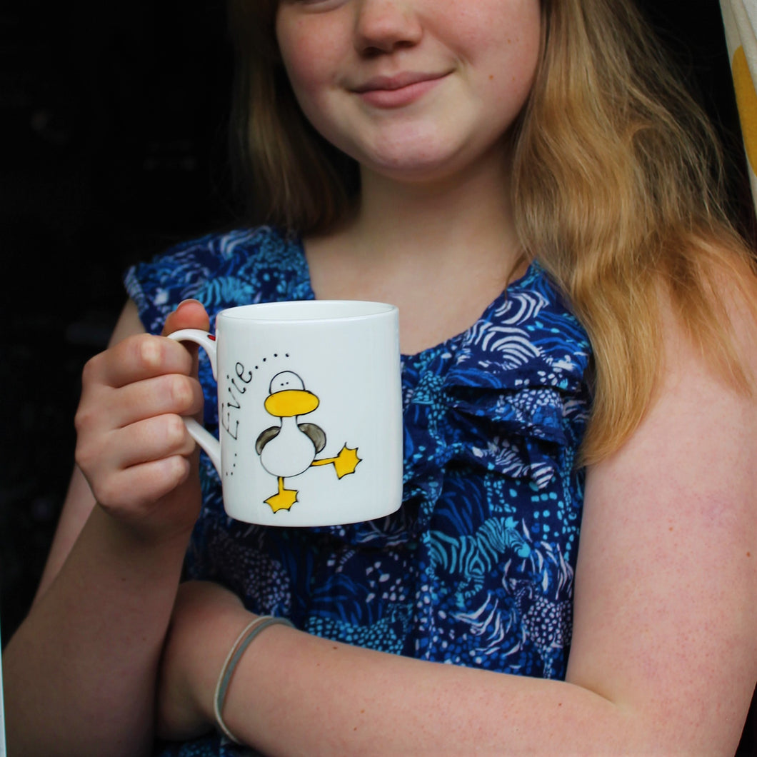 child drinking cocoa from a personalised dancing duck seagull mug