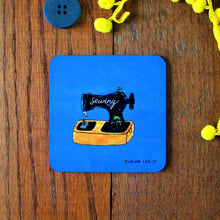 Load image into Gallery viewer, Sewing coaster blue featuring a vintage style sewing machine by Laura Lee desisgns Cornwall colourful homewares and gifts