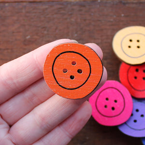 Orange button brooch by Laura Lee Designs in Cornwall