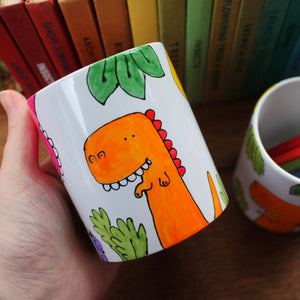 Orange dinosaur hand painted pot by Laura Lee Designs Cornwall