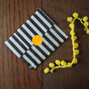 Black and white stripe gift bag with neon sticker seal