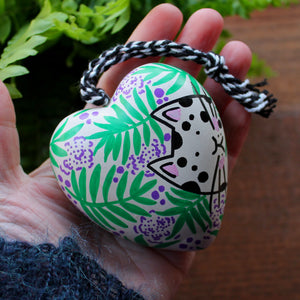 White cat with black spots ceramic heart hand painted by Laura Lee