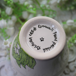 Signature on hand painted planter by Laura Lee Designs 
