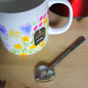 Tea bag tag inside hand painted fine china mug in colourful florals