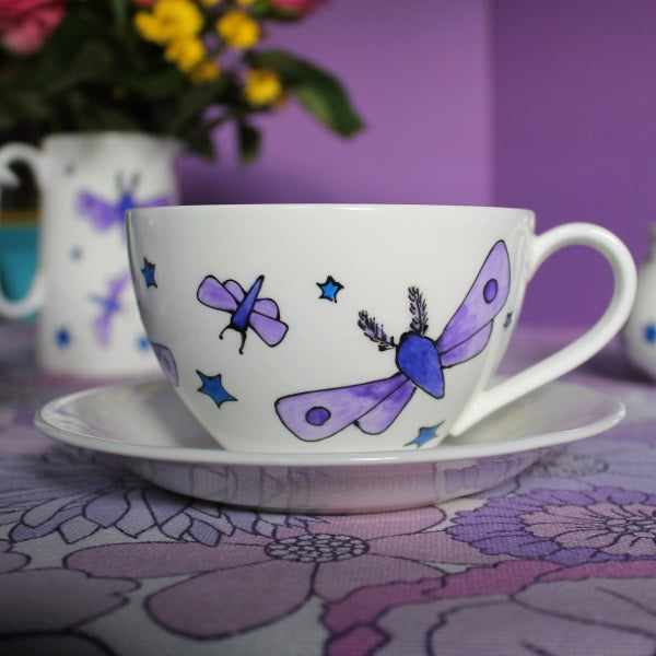 Moths and stars teacup and saucer hand painted by Laura lee designs 