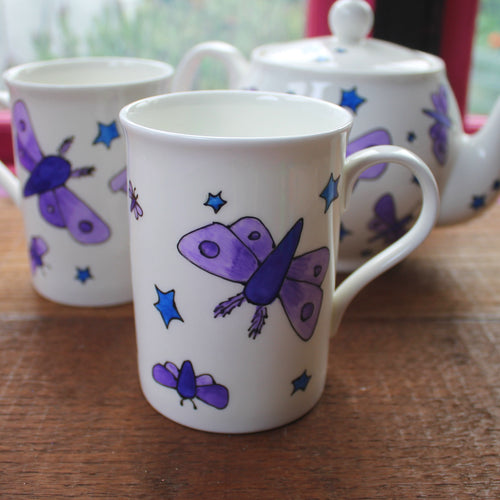 Moths and stars mug by Laura Lee Designs 