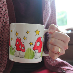 Big mug hand painted in mushrooms and stars by Cornwall based artist Laura Lee