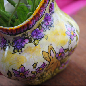 Close up of purple and pink roses on vintage bunny jug by Laura Lee Designs