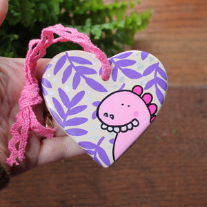 Goofy pink dinosaur heart hand painted by Laura Lee