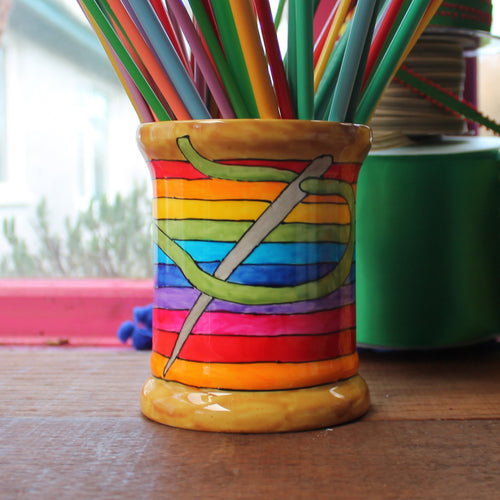 Rainbow sewing thread bobbin storage jar filled with knitting needles by Laura Lee Designs 