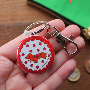 Colourful red and orange sausage dog keyring with a clip for using as a zip pull or bag charm by Laura Lee Designs Cornwall