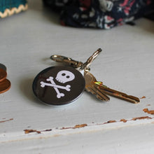 Load image into Gallery viewer, Black and white skull and crossbones steampunk goth keyring by Laura Lee Designs in Cornwall