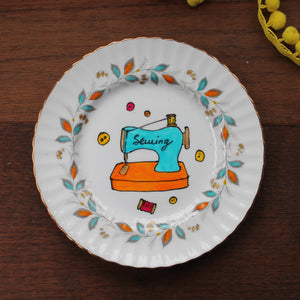 Turquoise and orange sewing machine the vintage pimp plate hand painted by Laura Lee in Cornwall