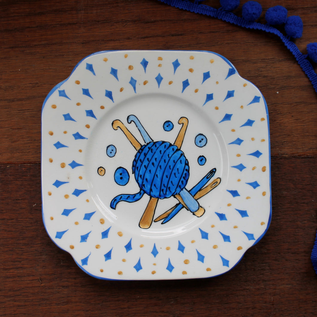 Blue and gold plate crocheting themed upcycled plate