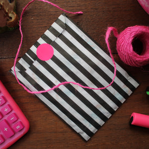 Gift wrap striped bag for notebooks with neon sticker seal